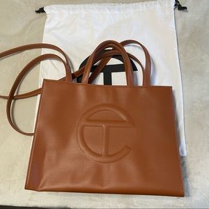 telfar tan medium shopping bag.